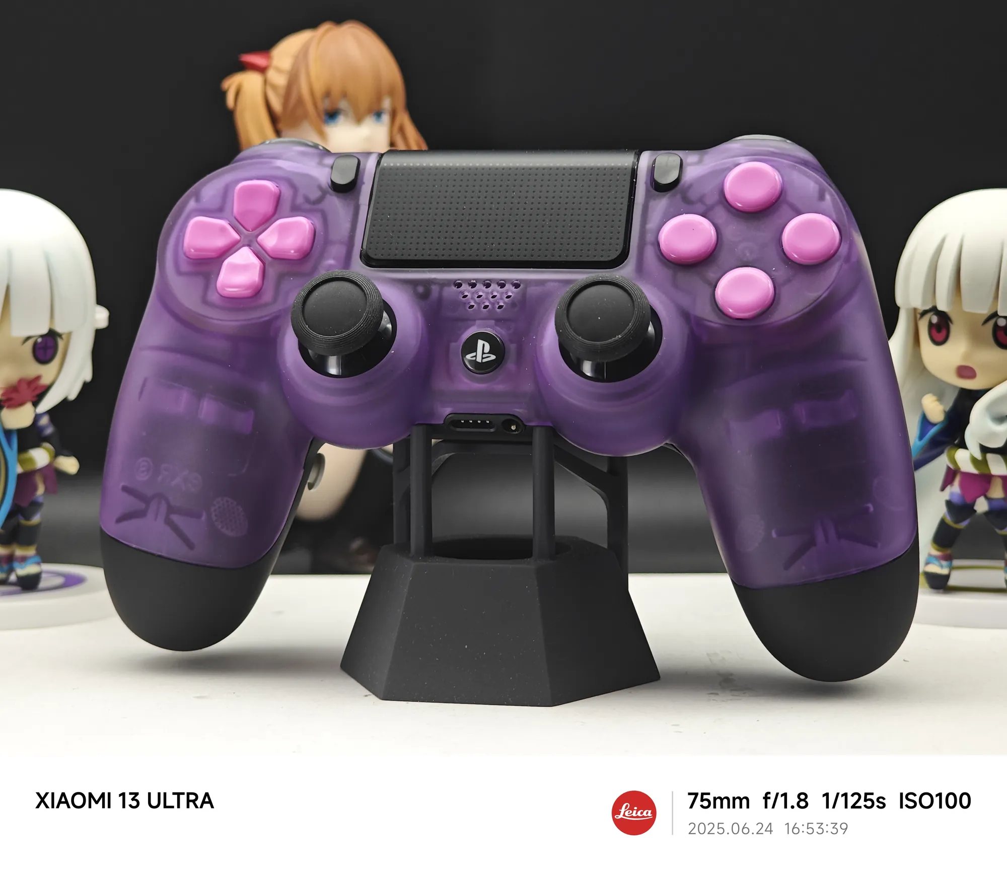 Purple translucent custom controller displayed on a stand